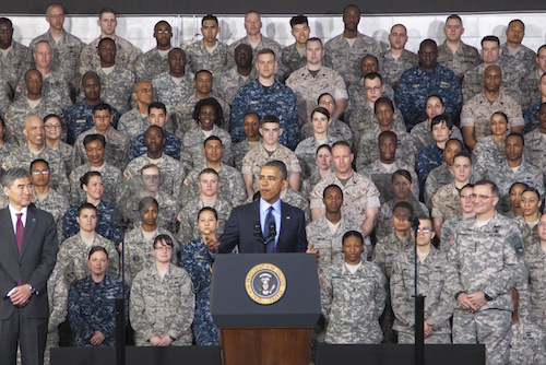 YONGSAN, South Korea (Apr. 26, 2014)-- US Forces Korea Service Members stand tall behind their Commander-in-Chief, President Barack Obama, during his speech at US Army Garrison Yongsan, South Korea April 26, 2014. President Obama took time out of his Asia-Pacific tour to thank Service Members and their families for their sacrifices and their role to strengthen the Republic of Korea-United States alliance. (U.S. Navy Photo by Mass Communication 2nd Class Chris Church)(Released)140226-N-SZ959-183